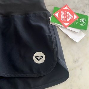 Roxy 4 way stretch black board shorts.